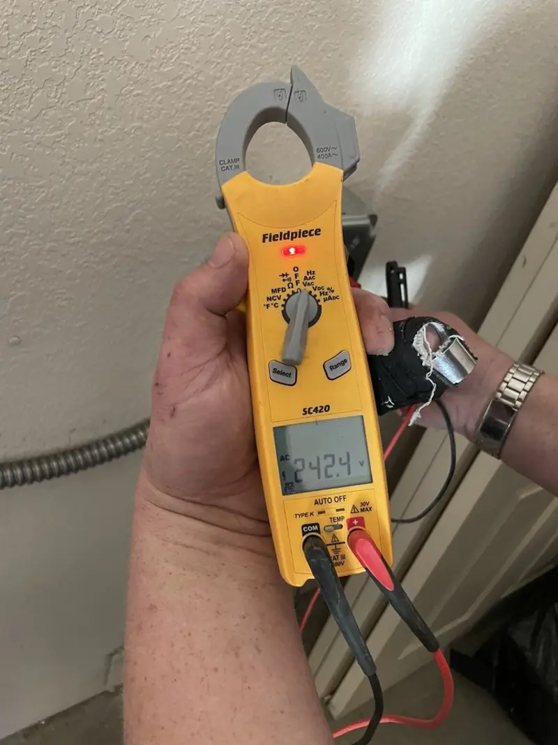 Voltage testing with clamp meter during Ceiling Fan Installation in San Juan Capistrano